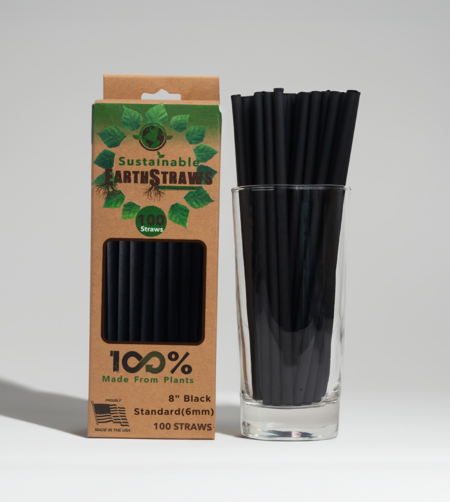 100-count pack of black 8-inch long, 6mm wide compostable hemp straws next to a stack of black hemp straws